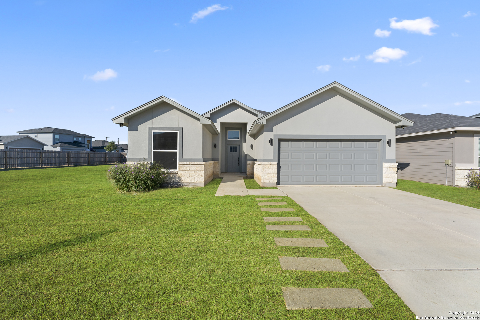 a front view of a house with yard