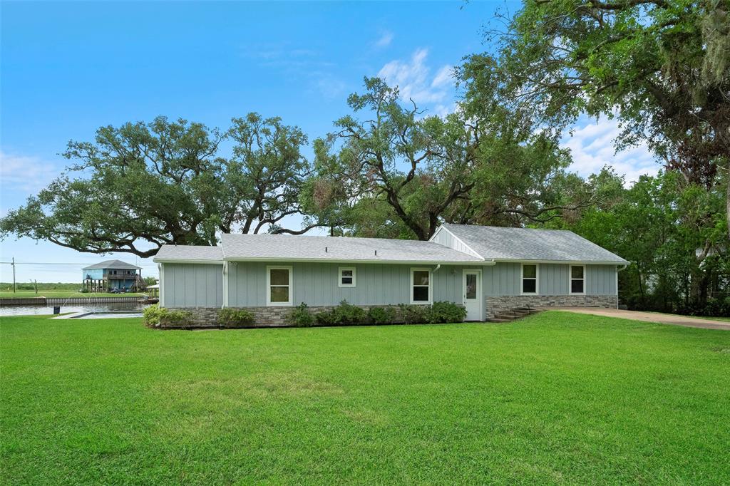 a front view of house with a garden