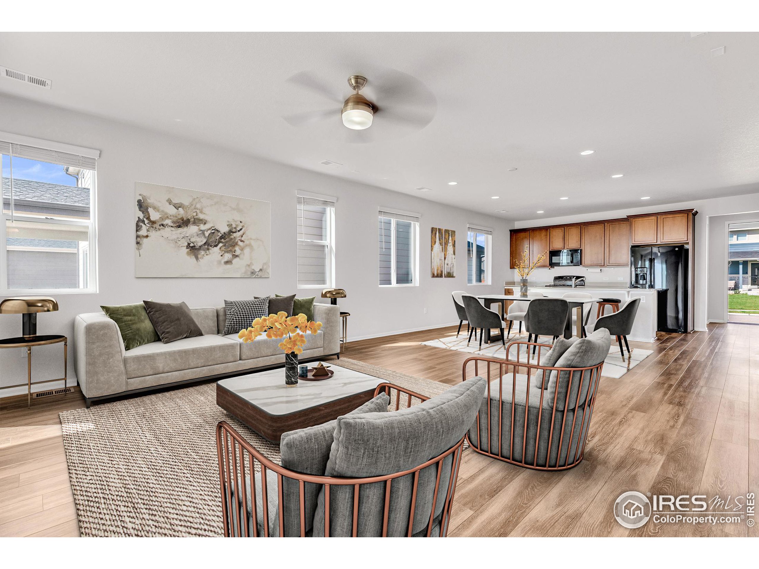 a living room with furniture and kitchen view