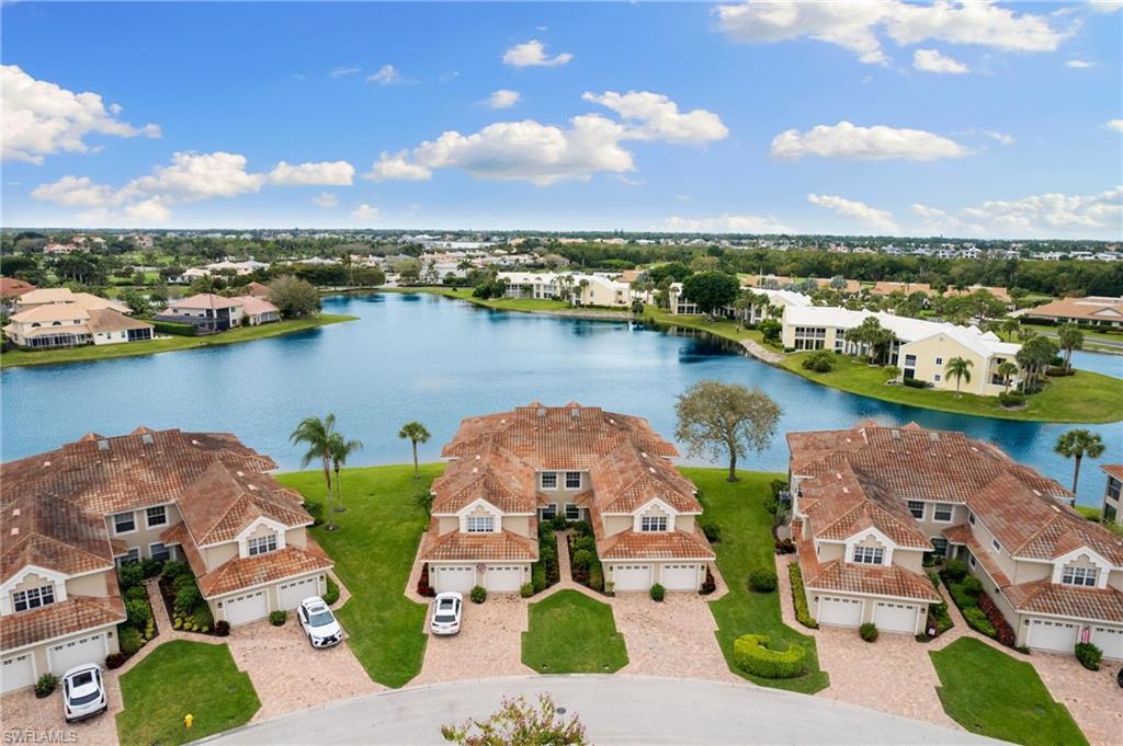 an aerial view of a house with a lake view