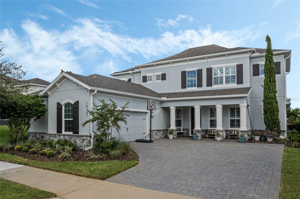 a front view of house with yard and green space