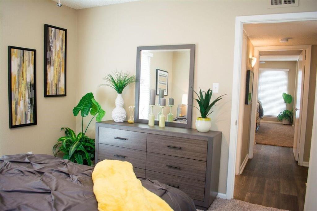 a view of a bedroom with a potted plant