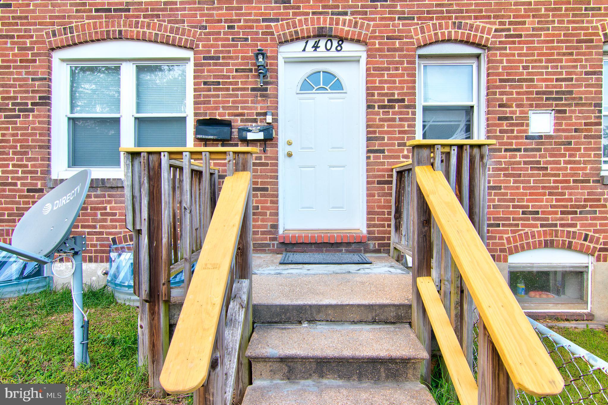 a view of an entryway with wooden floor and stairs