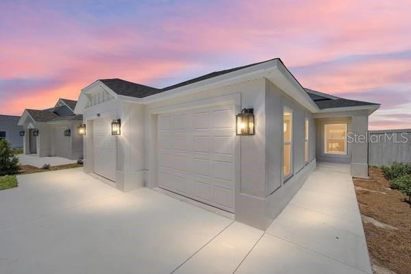 a yellow house with a outdoor space