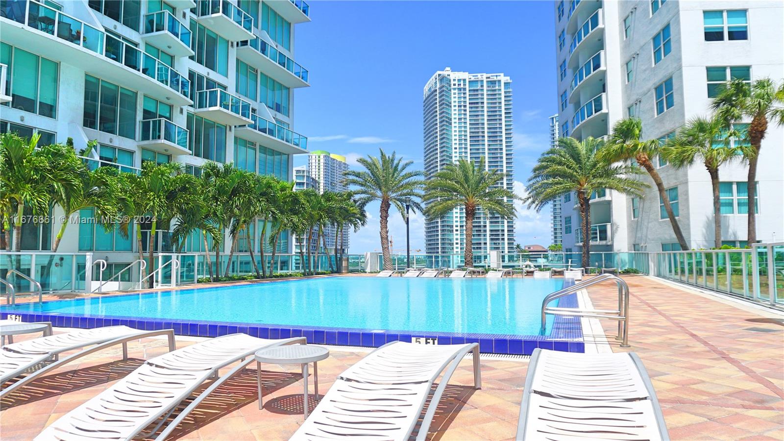 a view of a swimming pool with a lounge chairs