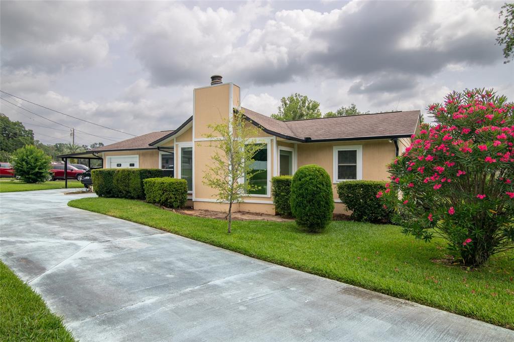 a front view of house with yard and green space