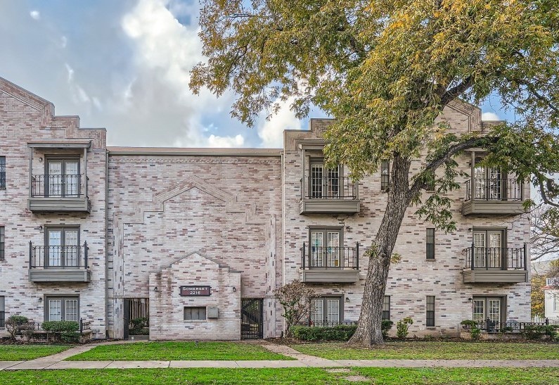 a view of a building with a yard