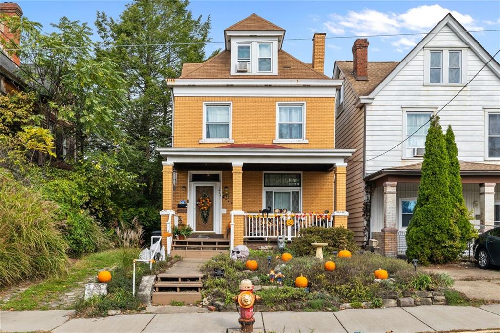 a front view of a house with garden