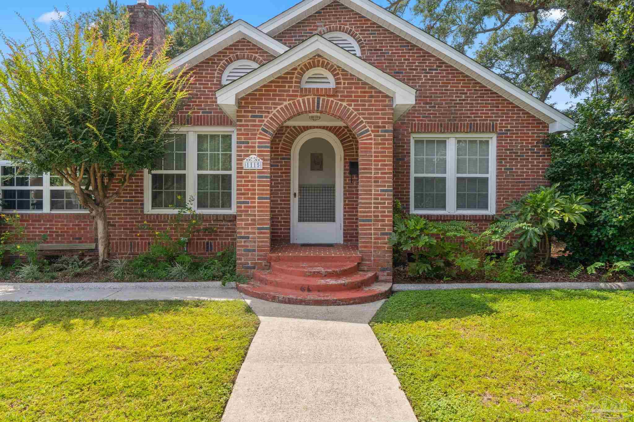 a front view of a house with swimming pool