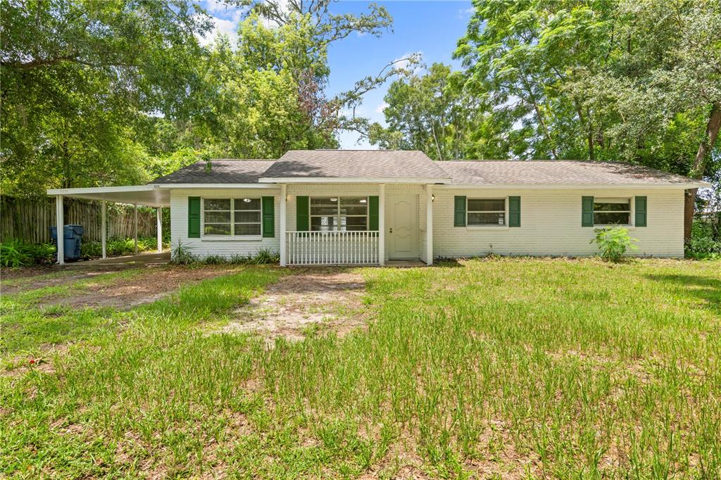 front view of a house that has a yard