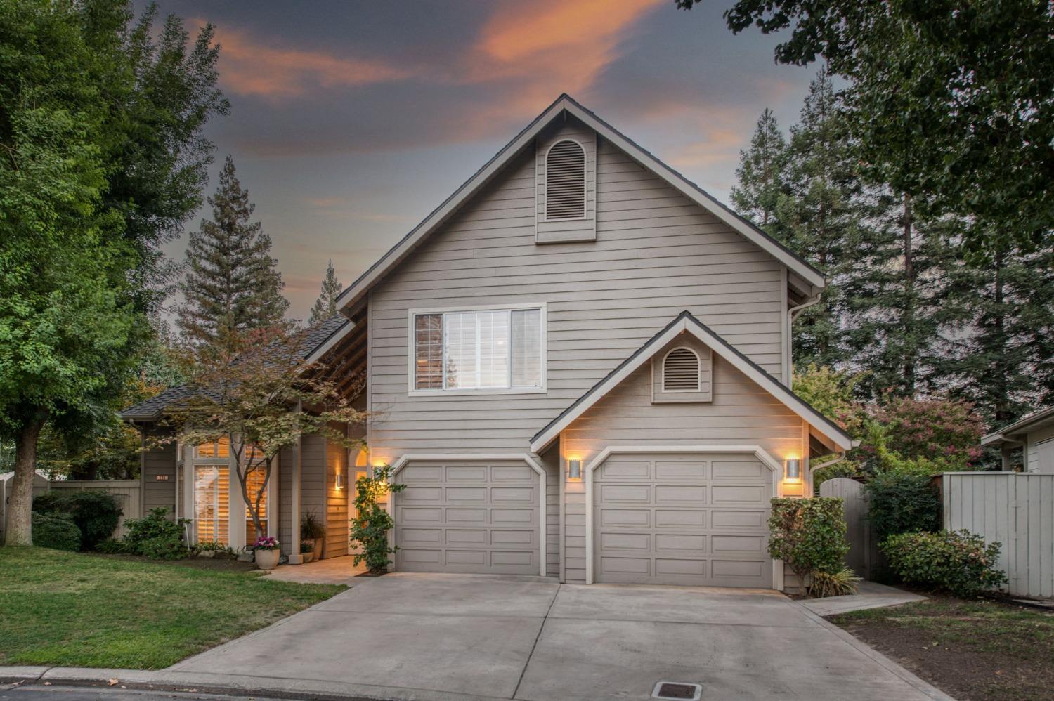 a view of house with a yard and tree s