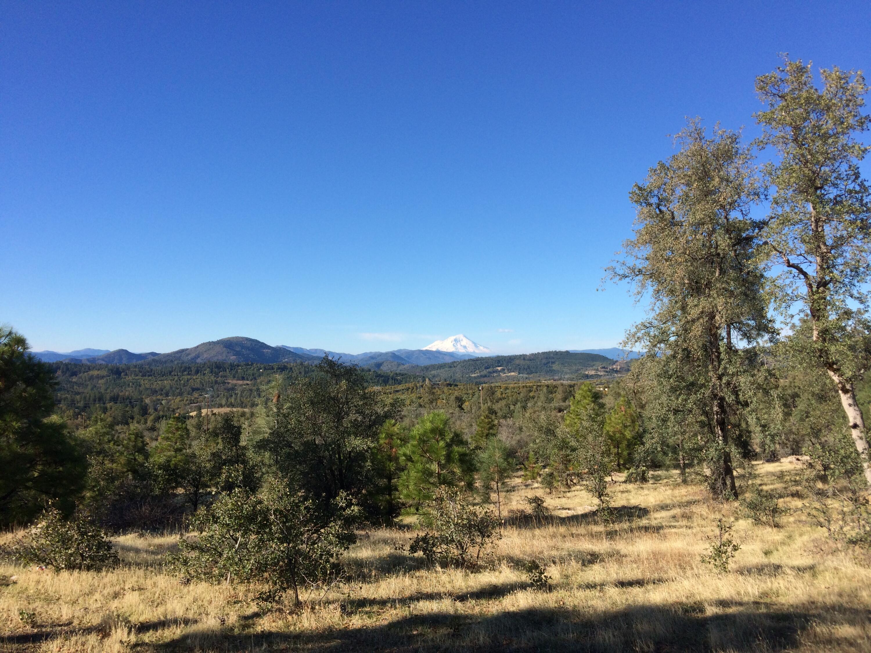 a view of a mountain with a mountain in the background