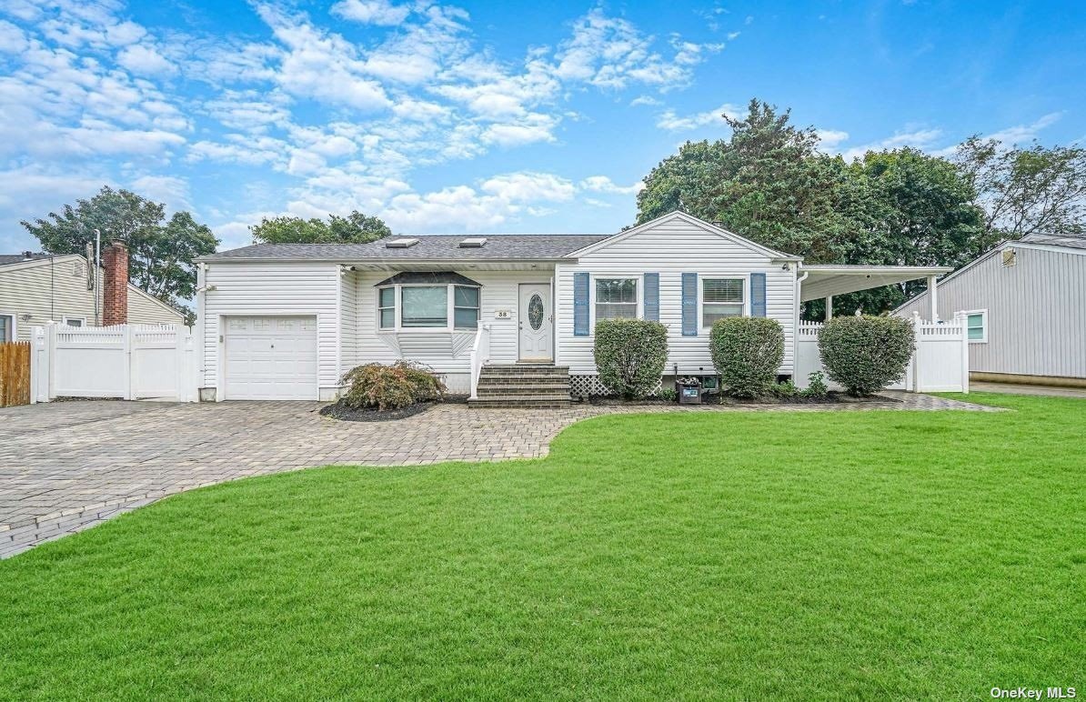 a front view of a house with a garden