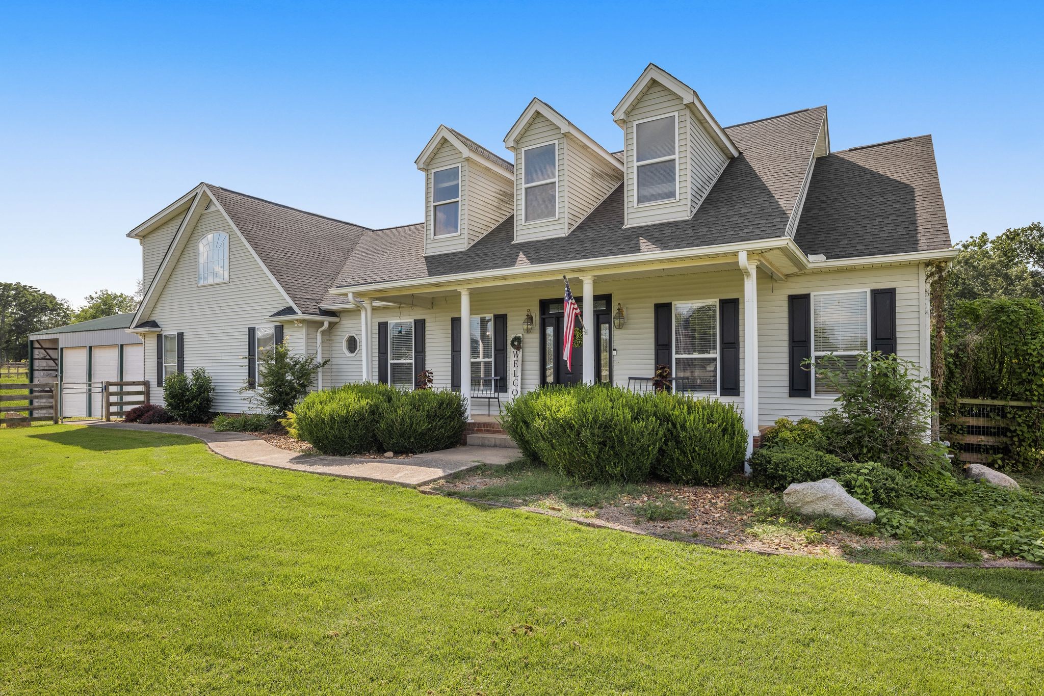 a front view of a house with a yard