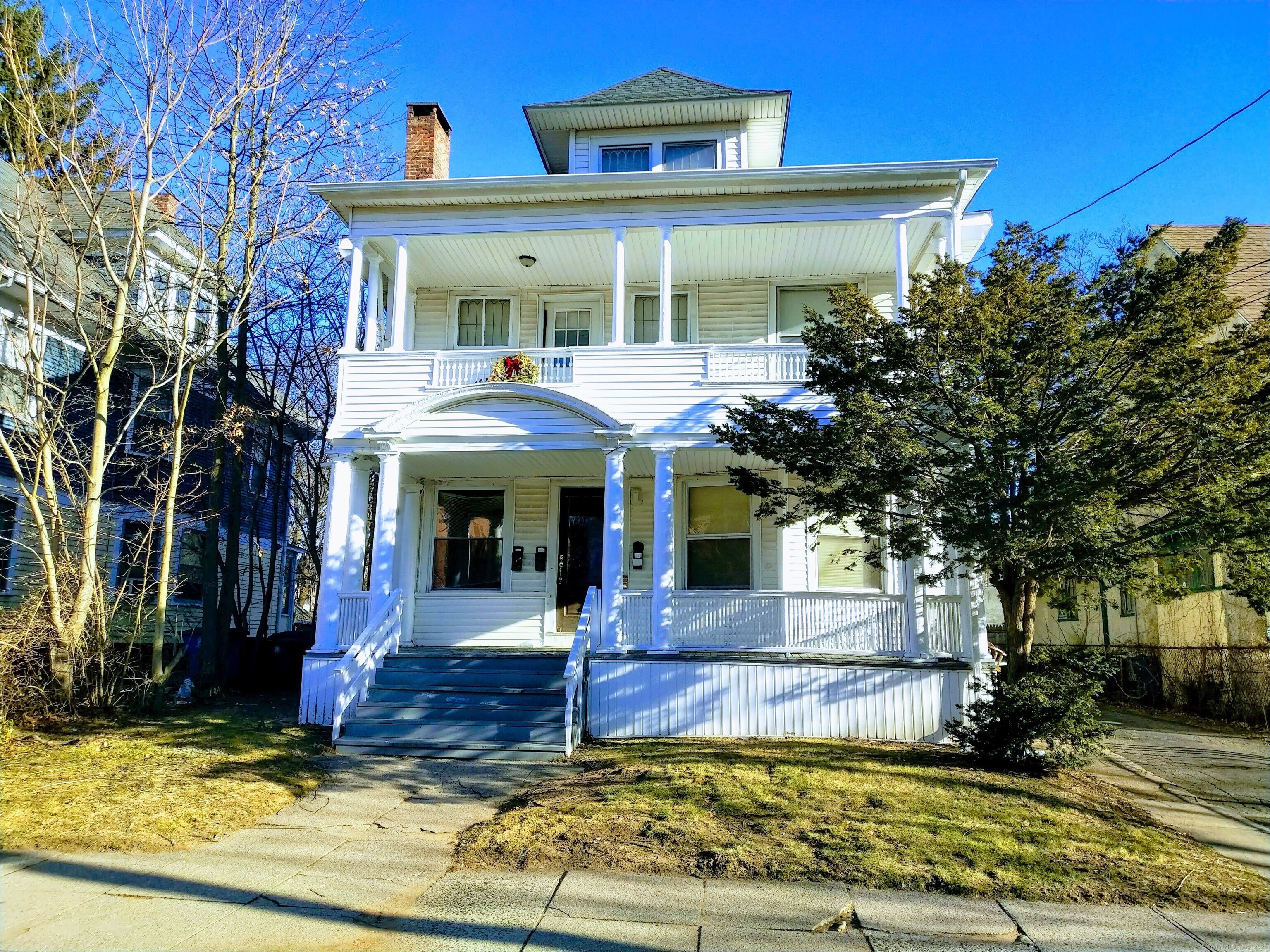 a front view of a house with swimming pool