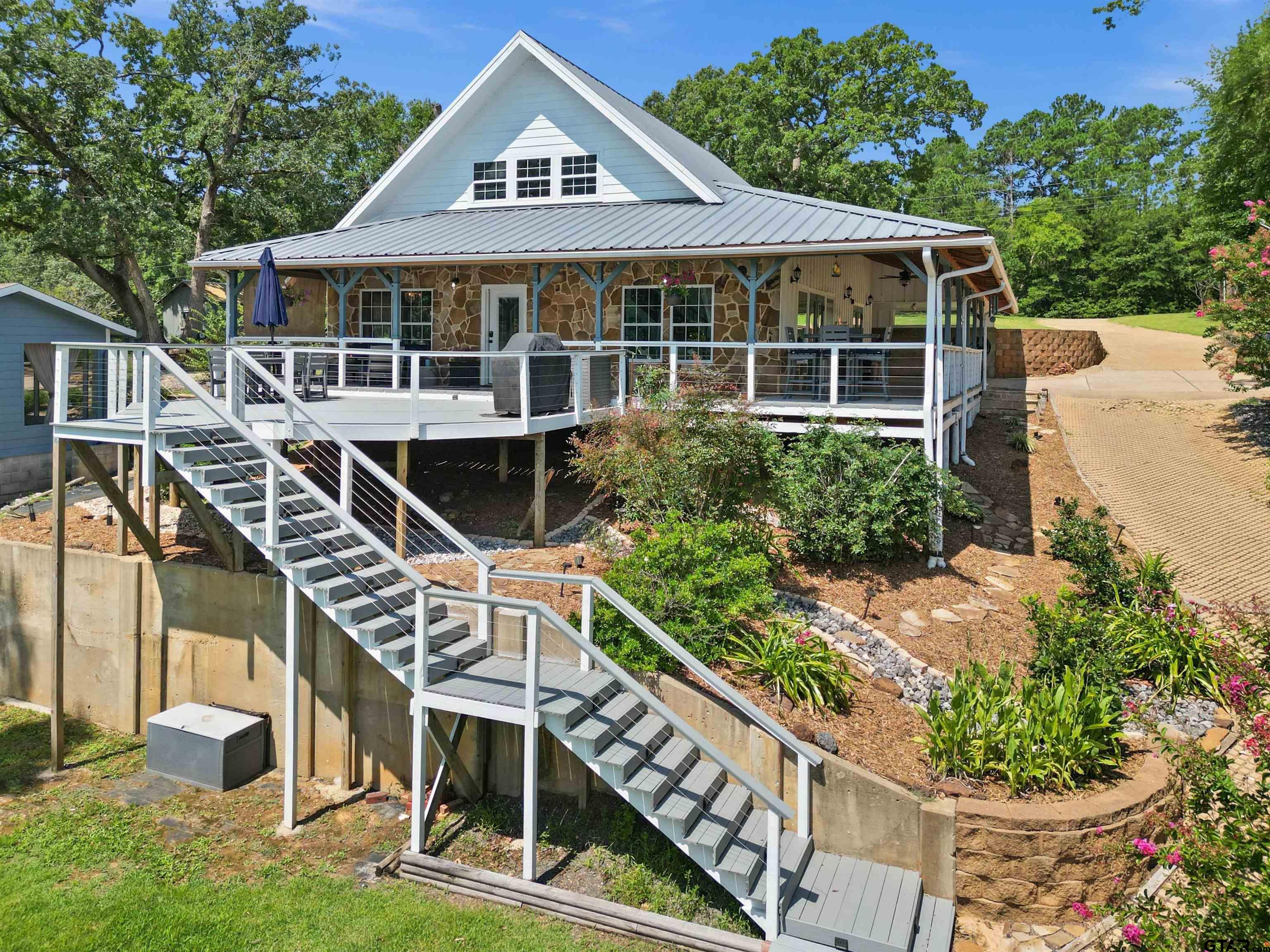 a very nice looking house with a large windows and a yard