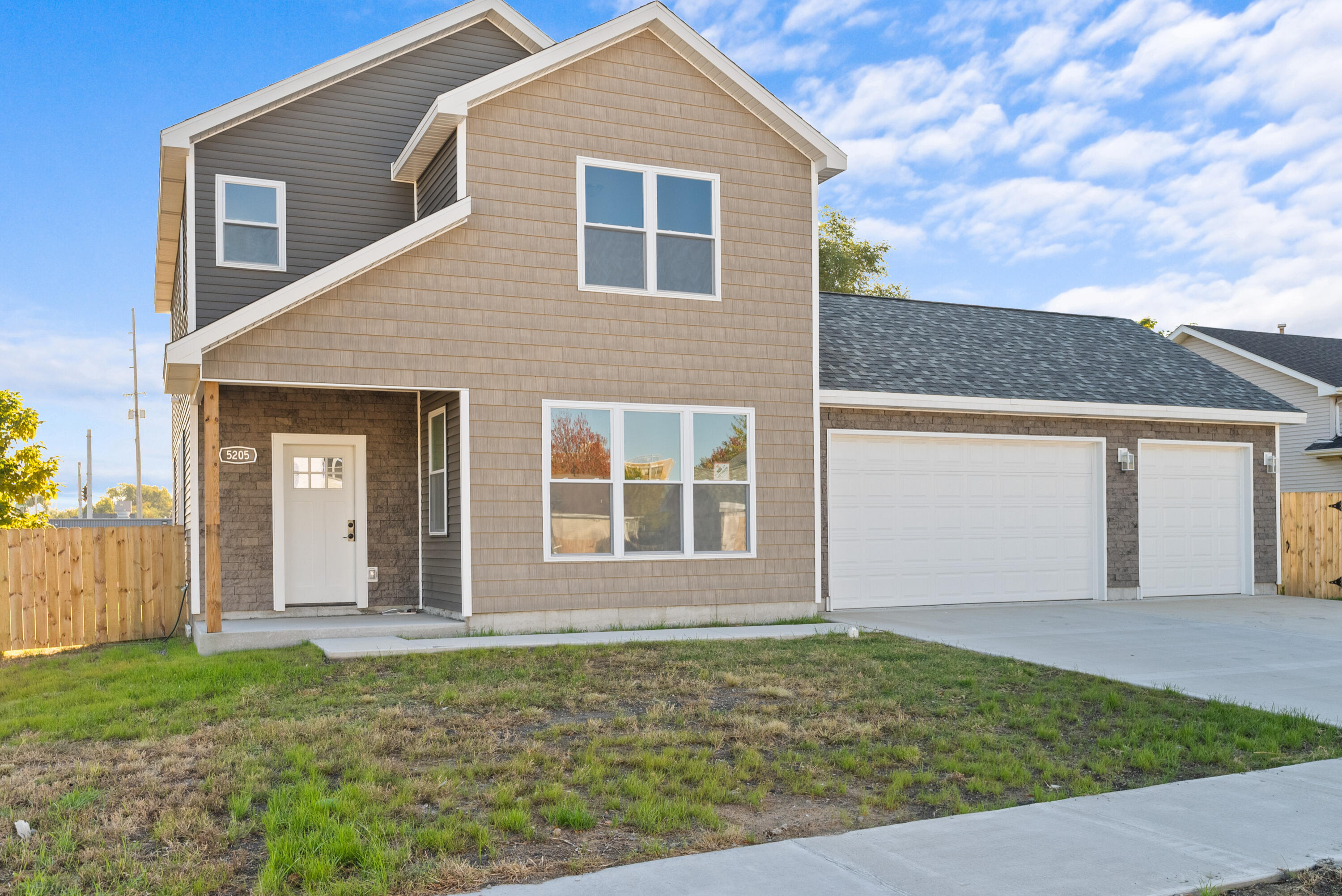 front view of a house with a yard