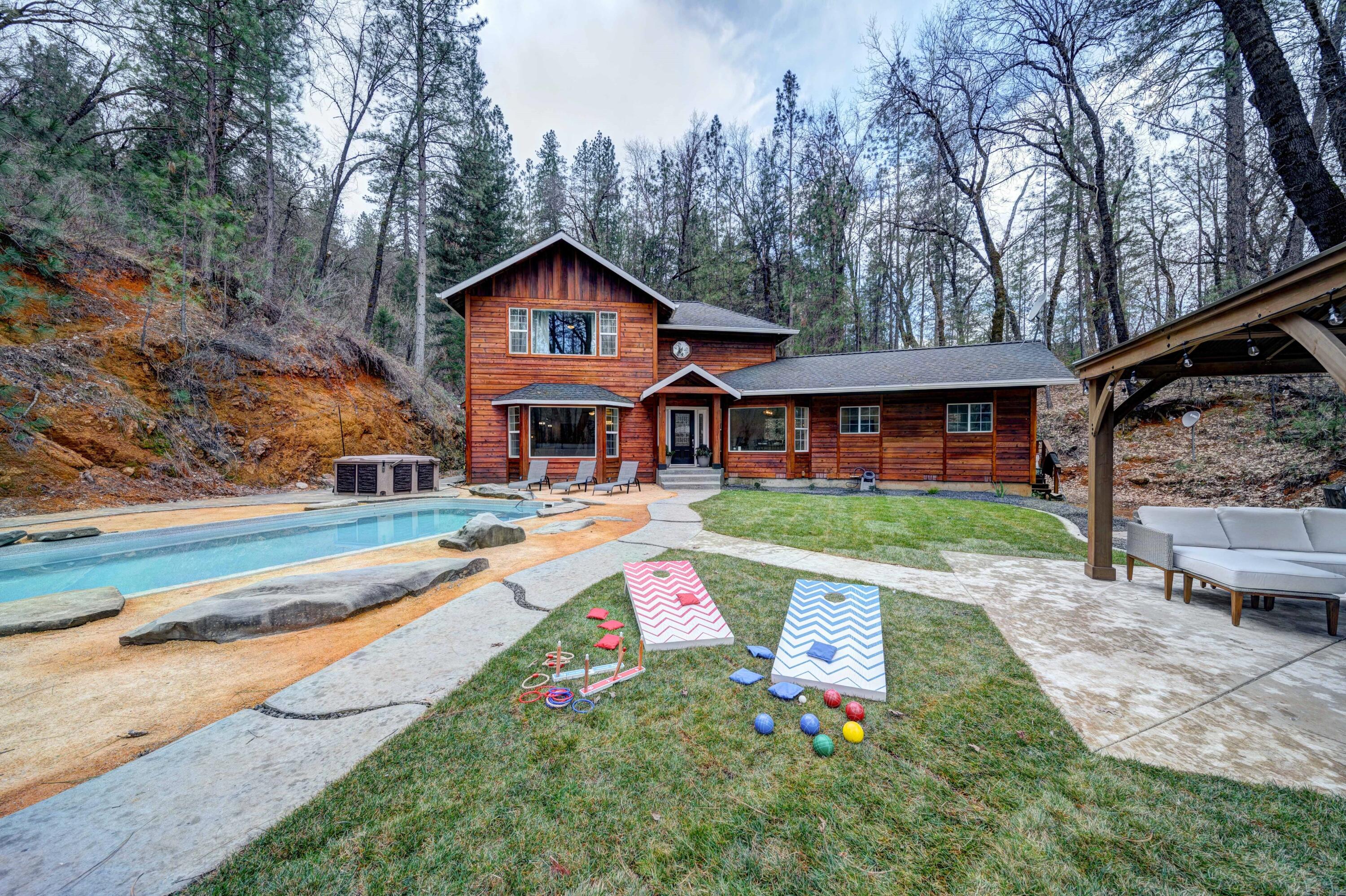 a front view of house with yard and green space