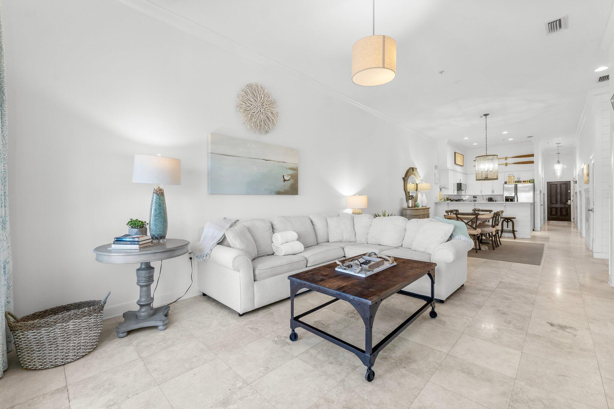 a living room with furniture and a lamp