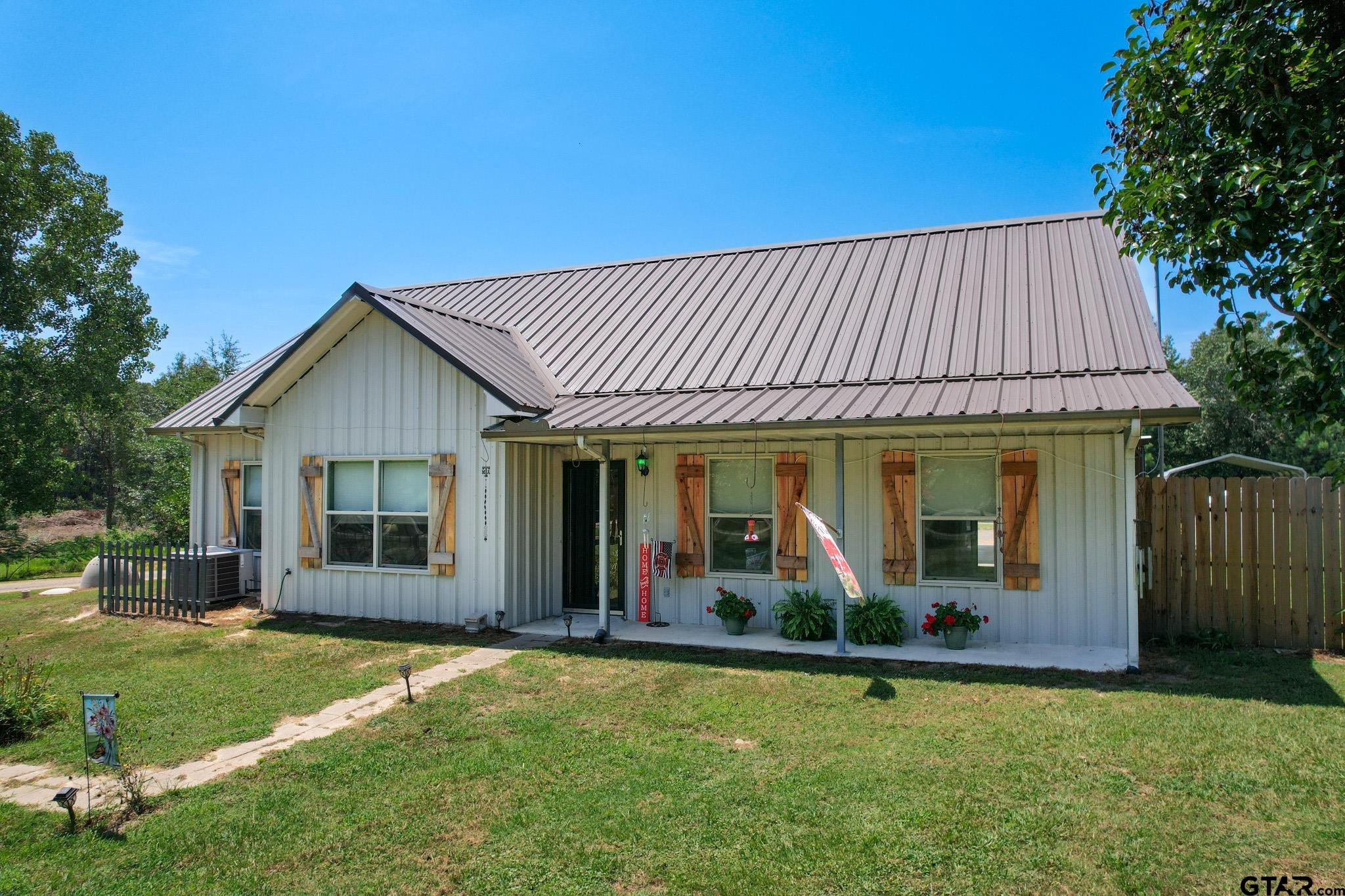 front view of a house with a yard