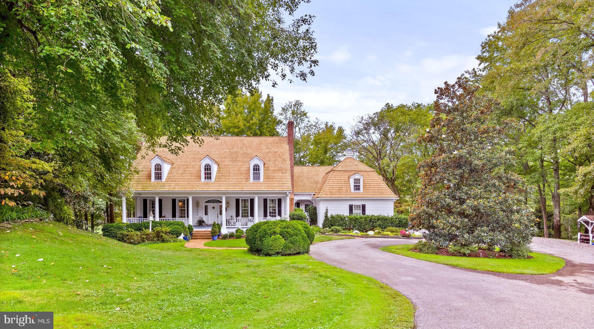 a front view of house with yard and swimming pool