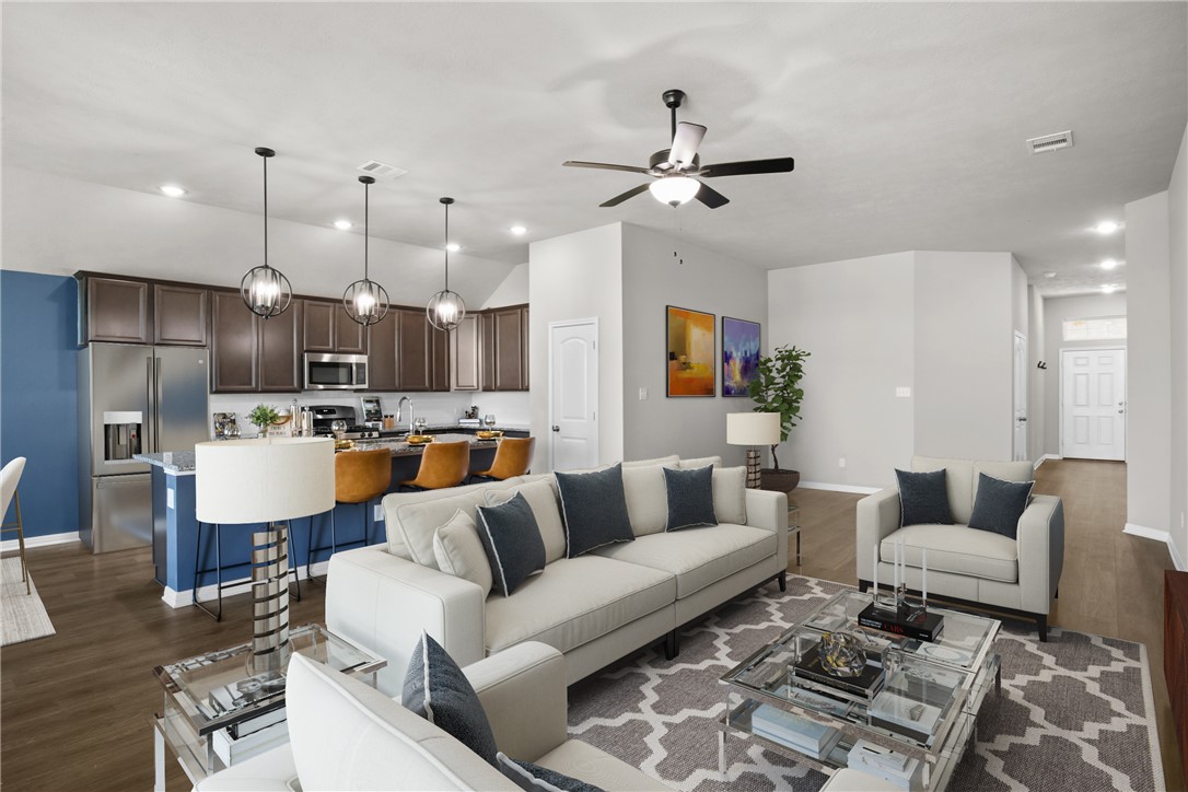 Living room with ceiling fan and dark wood-type fl