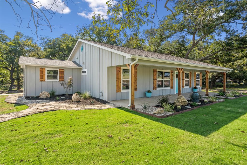 a backyard of a house with garden and patio