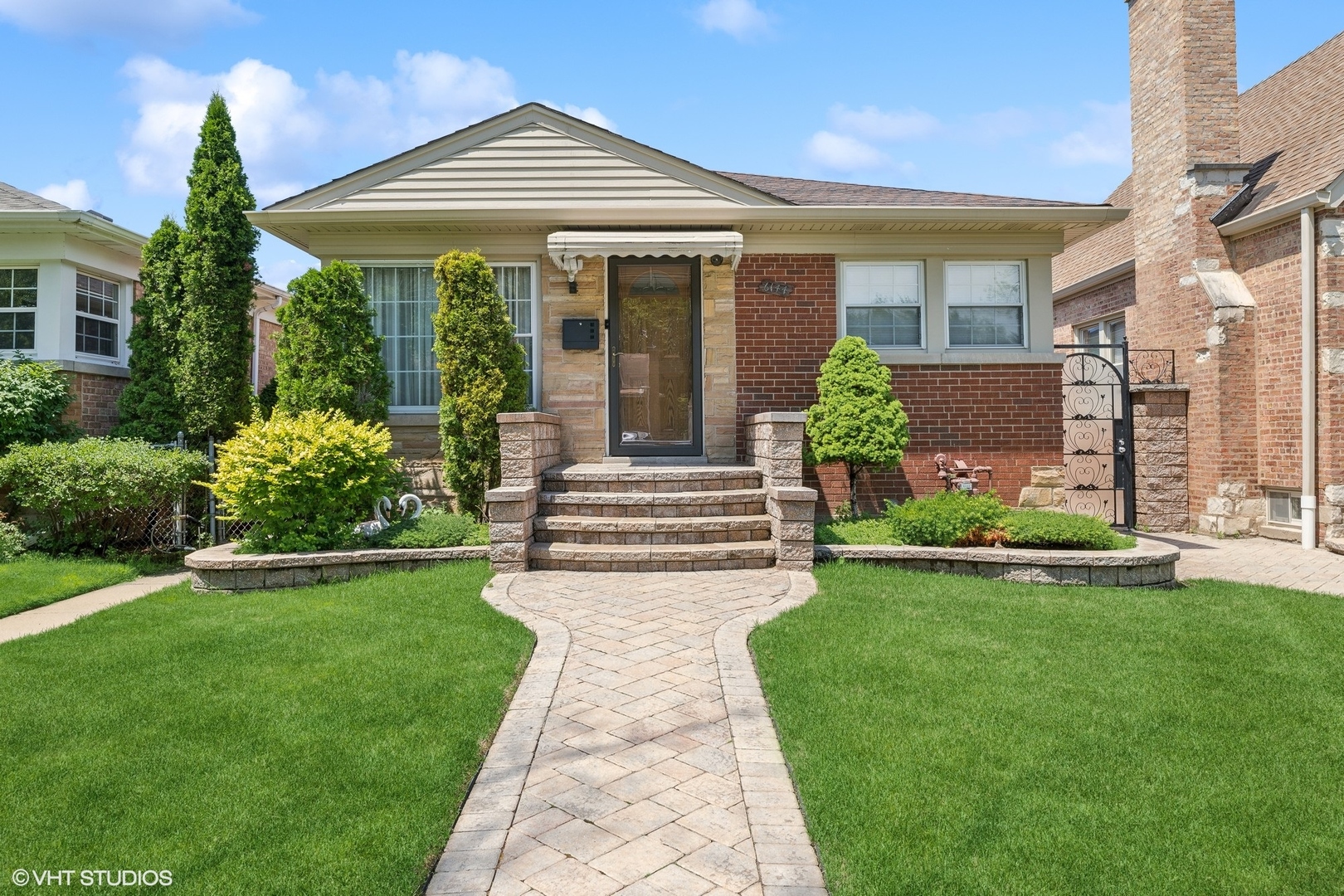 a front view of a house with garden