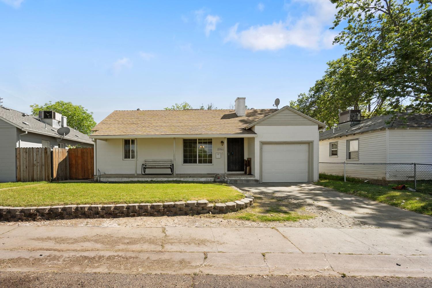 a view of a house with a swimming pool and a yard