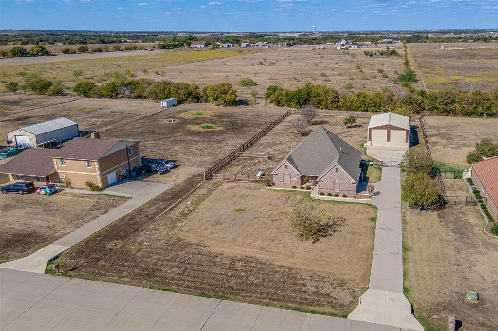 an aerial view of a house with a lake view