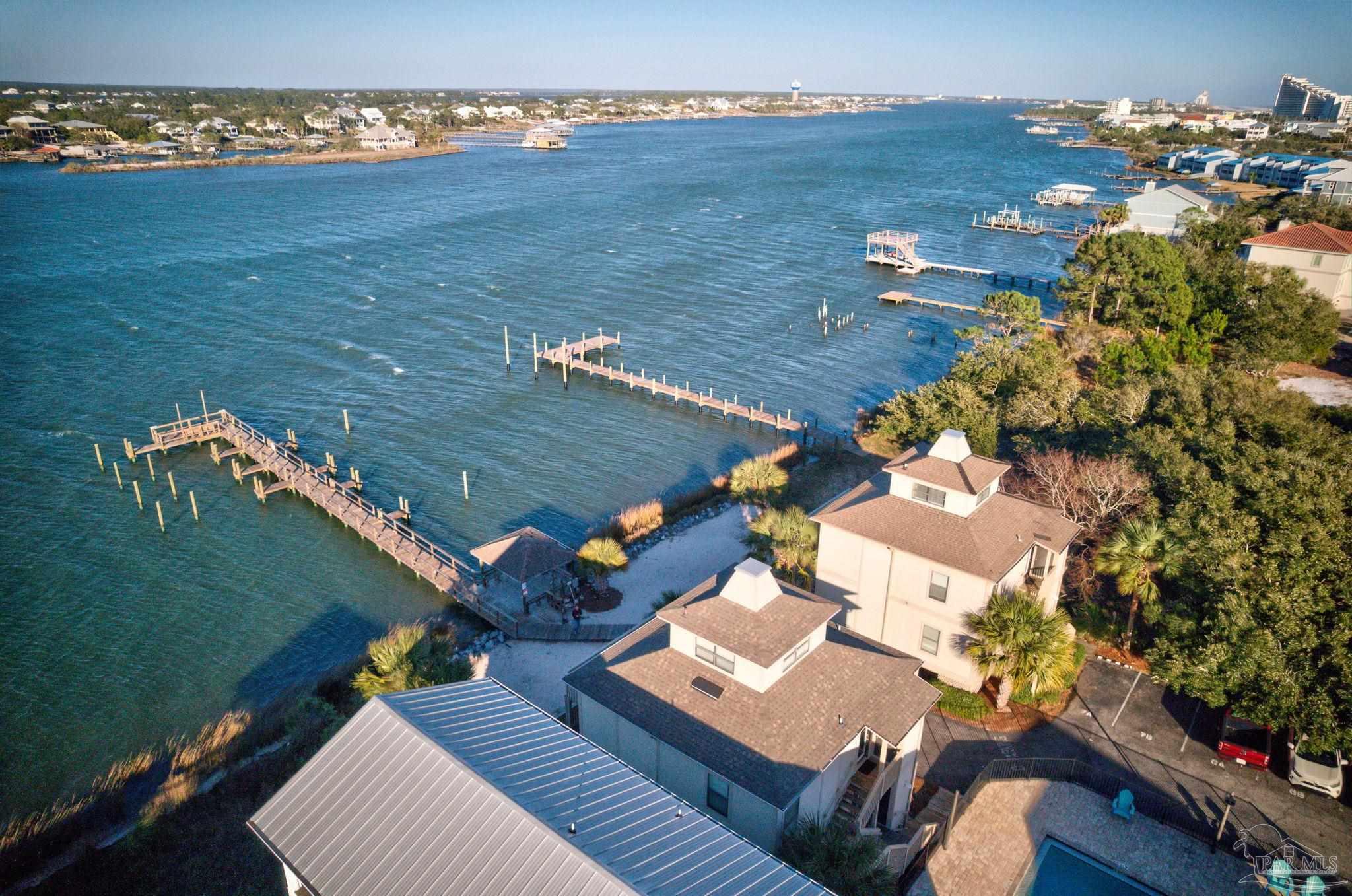 an aerial view of a house with a ocean view