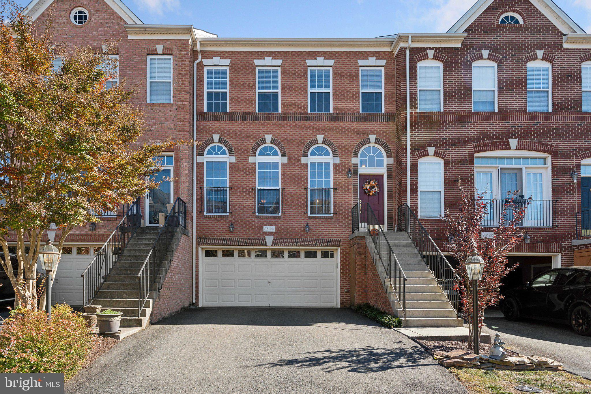 a front view of a building with garden