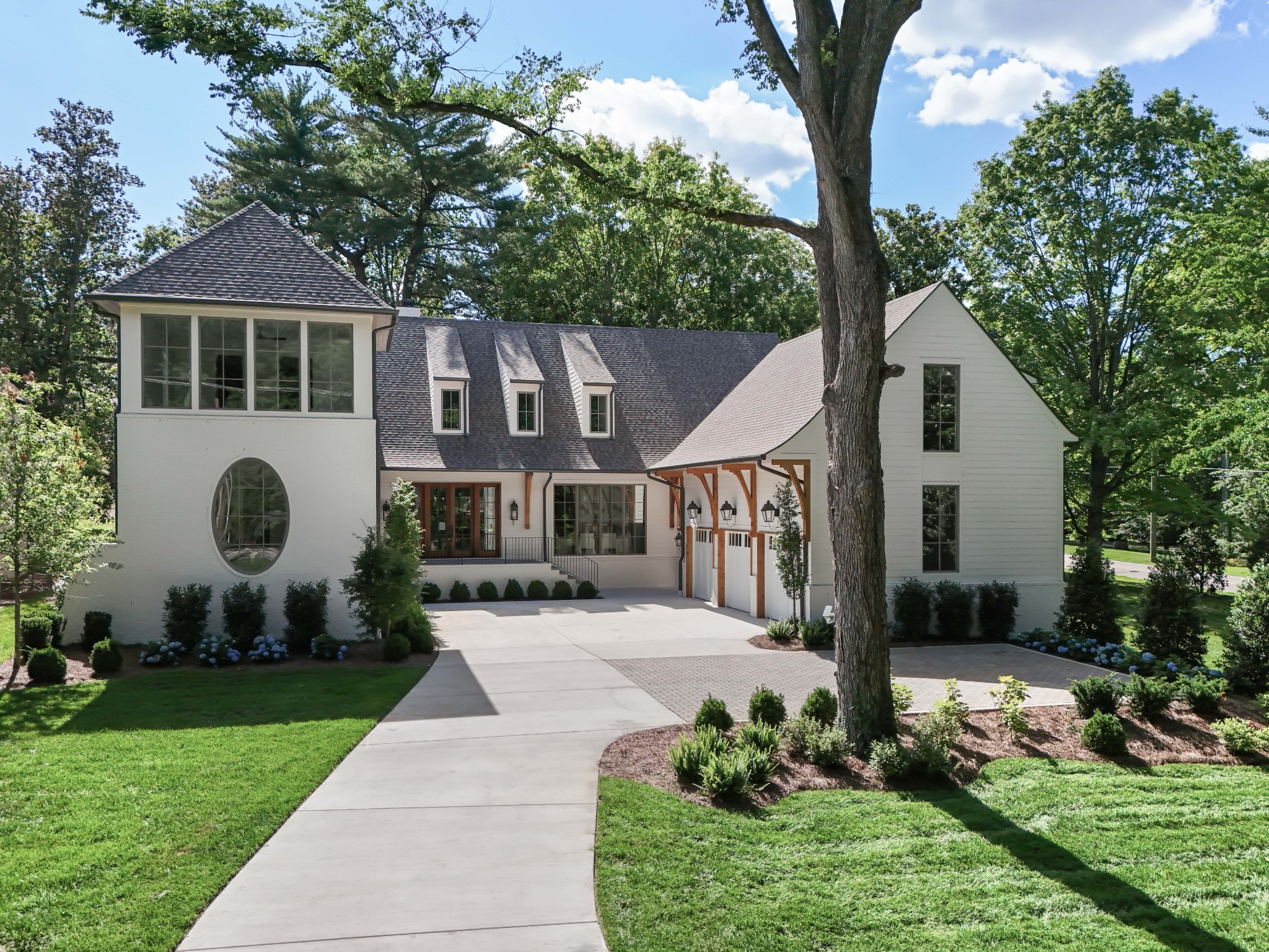 a front view of a house with garden