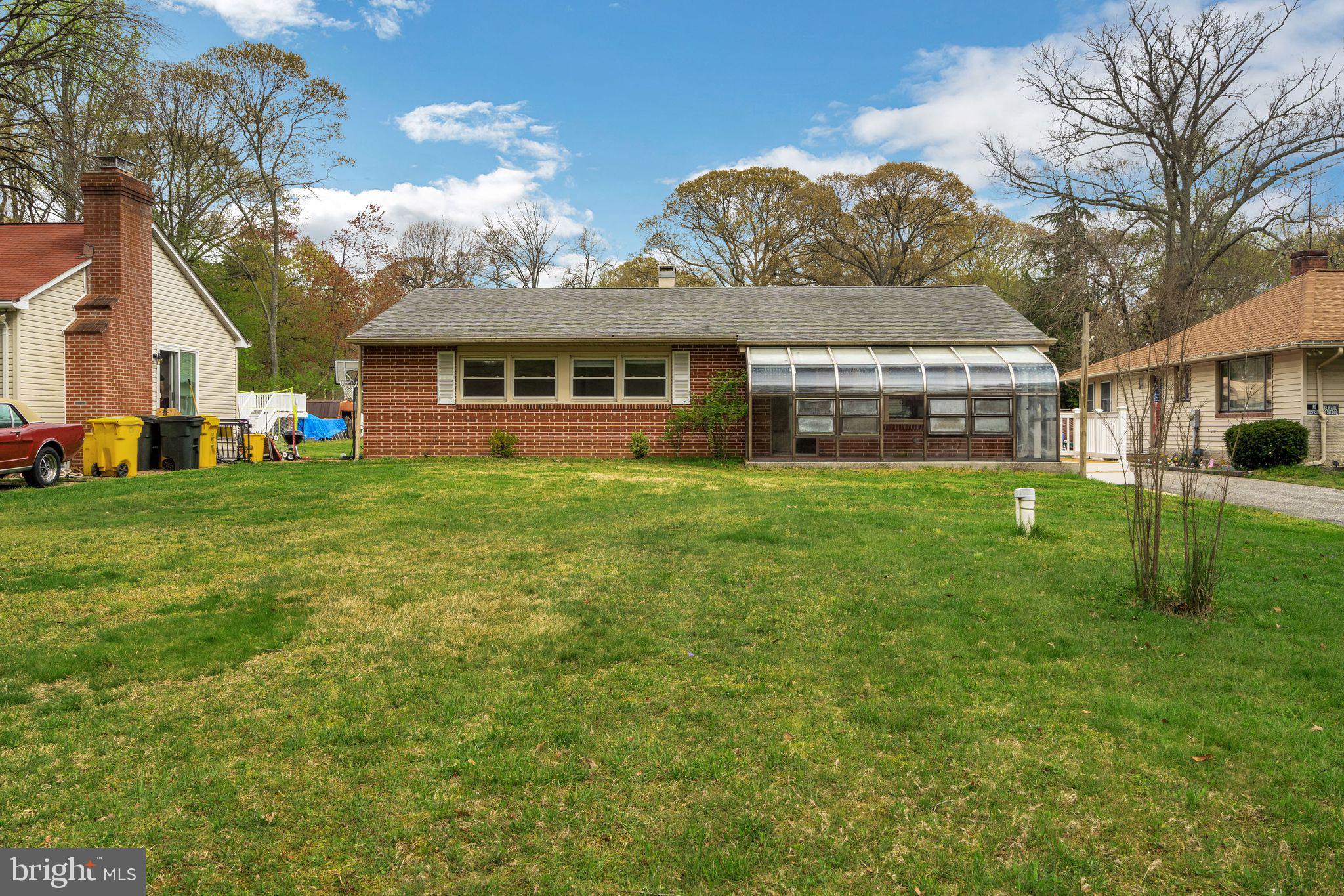 a view of a yard in front of a brick building