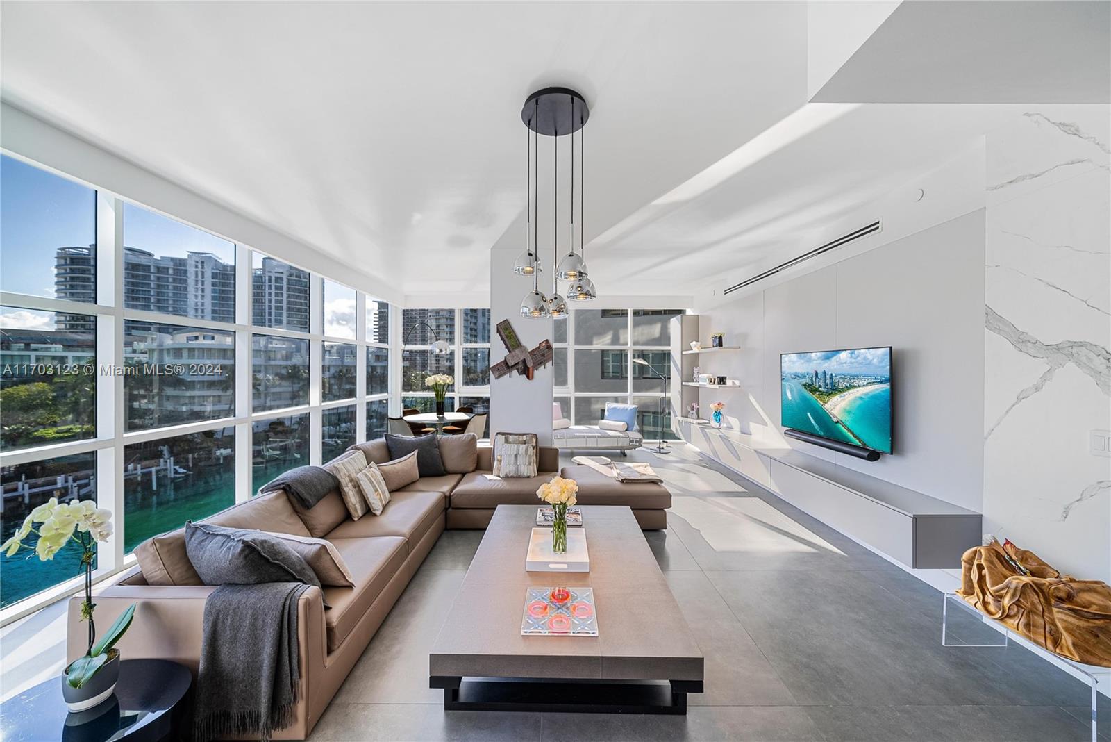 a living room with furniture and a flat screen tv