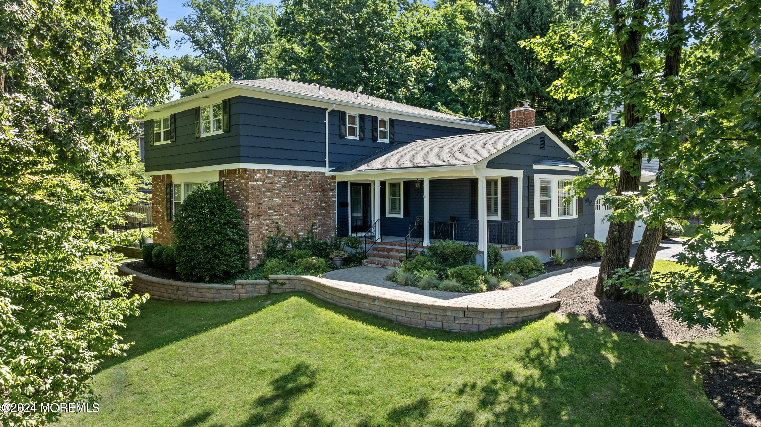 a view of a house with backyard garden and swimming pool