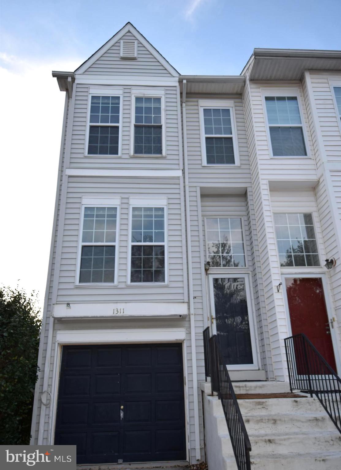 a front view of a house with outdoor space