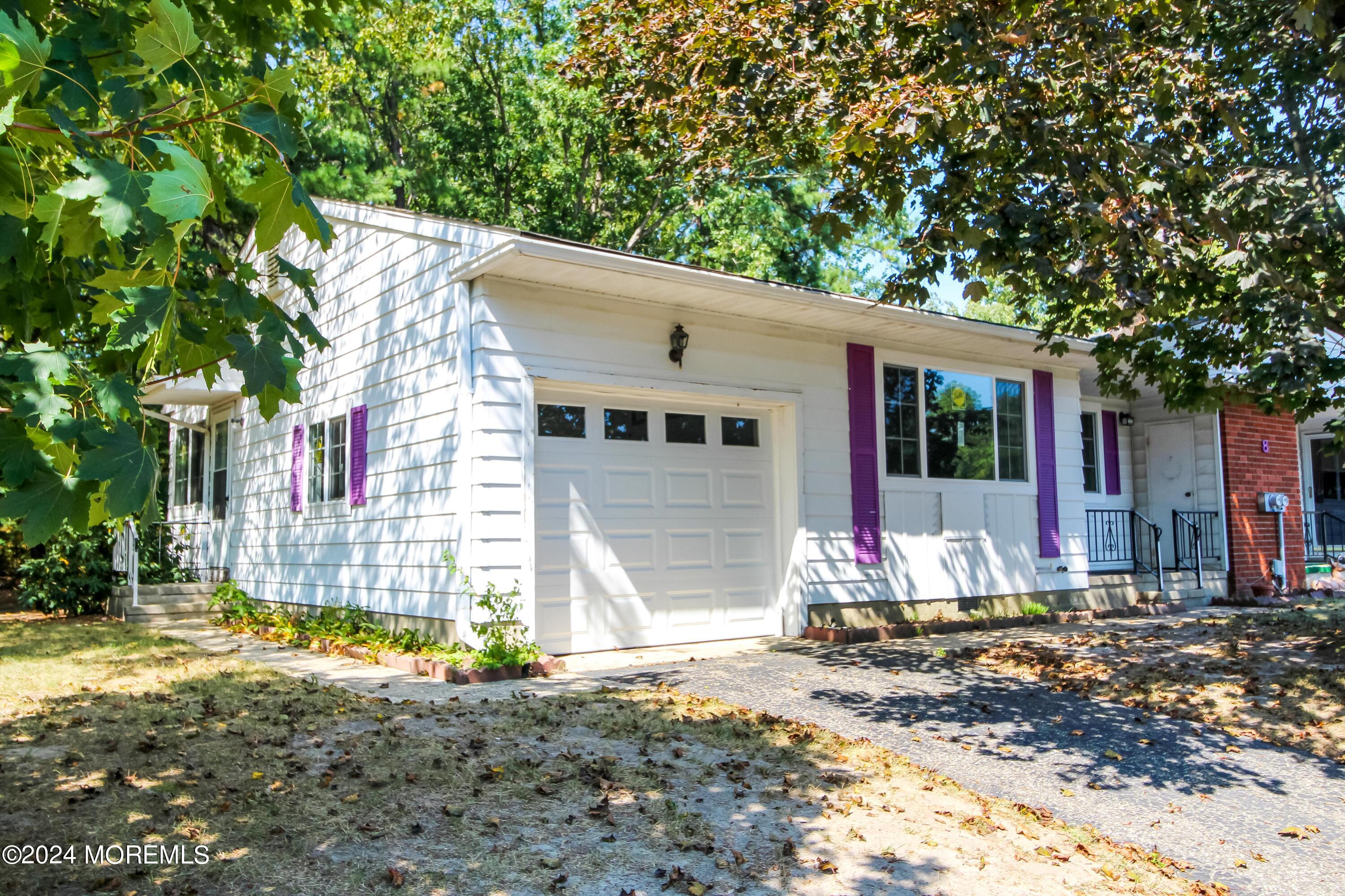 front view of a house with a patio