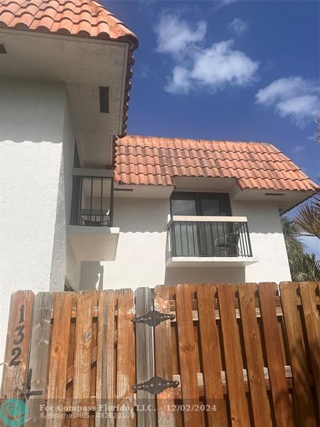 a front view of a house with a balcony