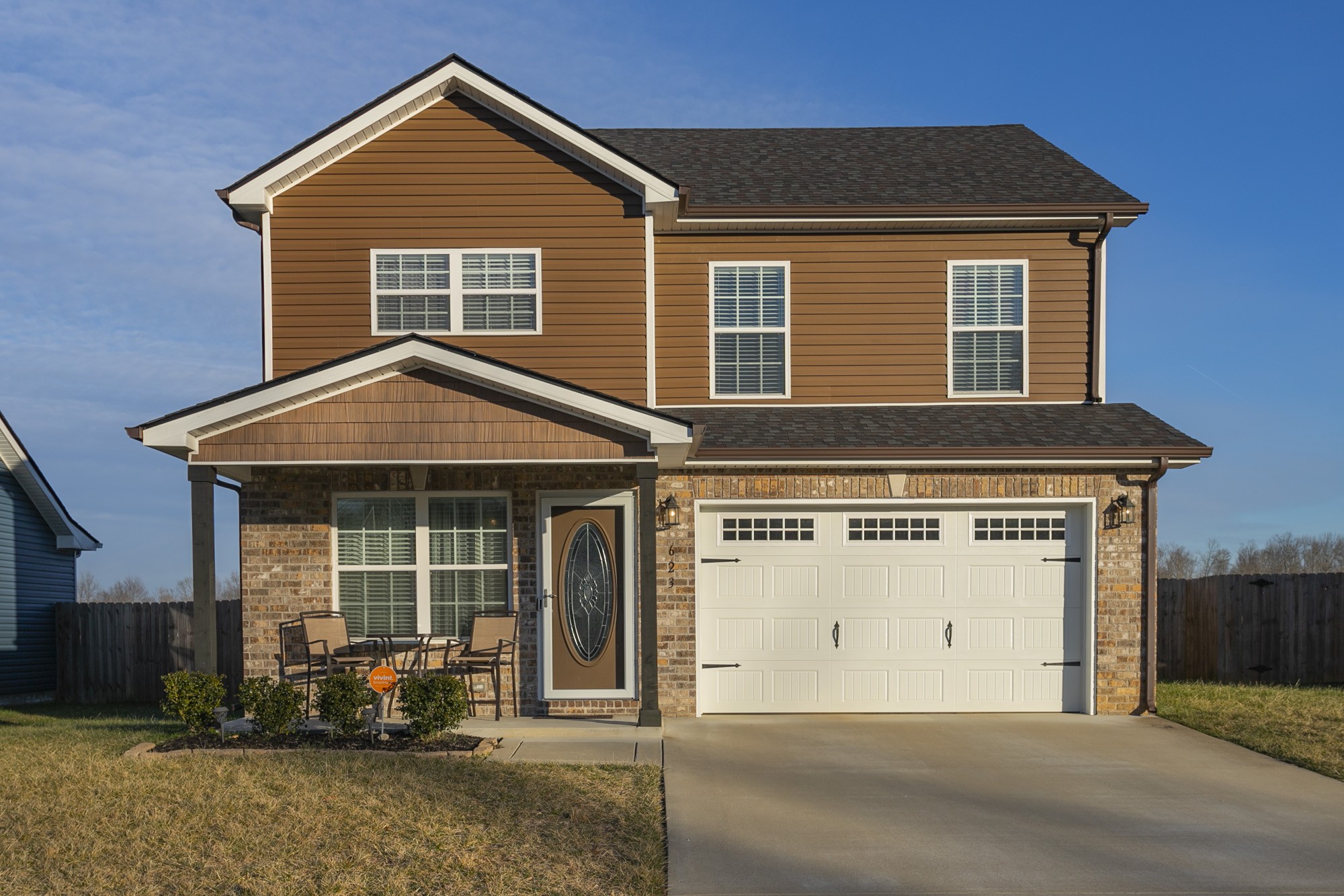 a front view of a house with a yard