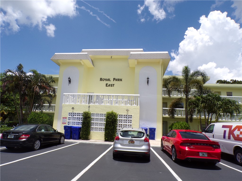 a view of a car park in front of house