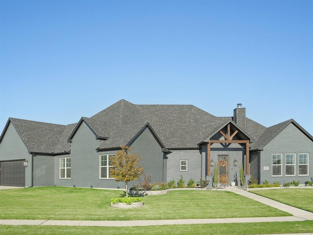 a front view of a house with a yard