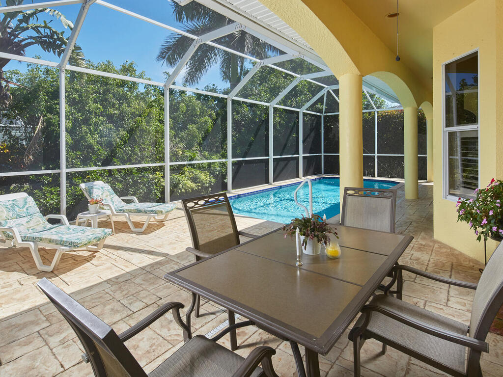 a view of a dining table and chair in the patio