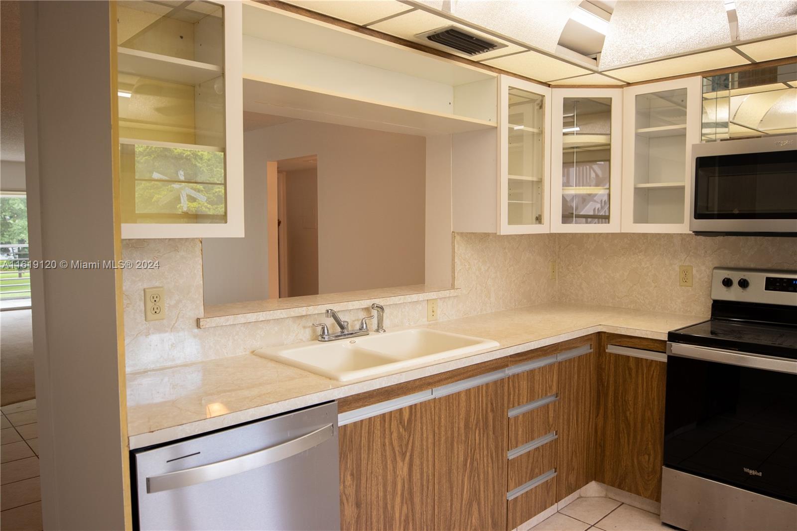 a kitchen with a sink and a window