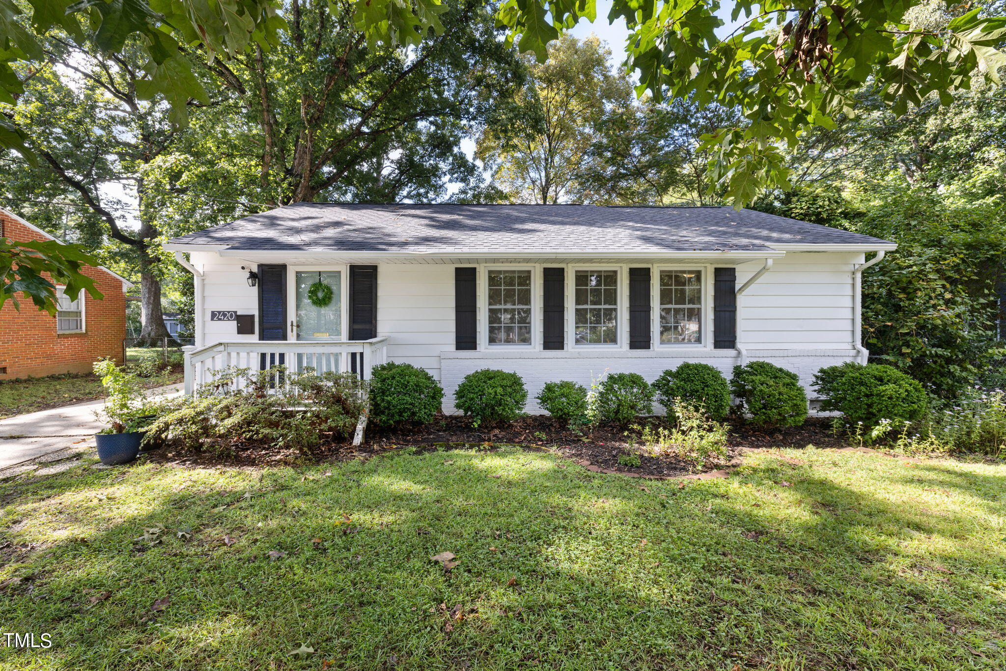 front view of a house with a yard