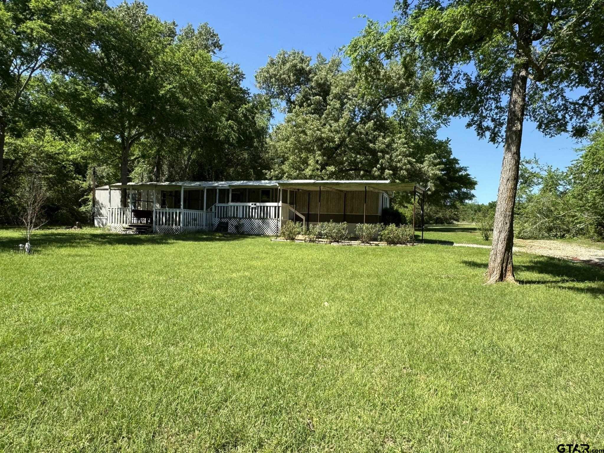 a view of a house with a big yard