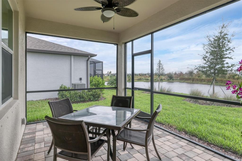 a view of an outdoor dining space with a table and chairs