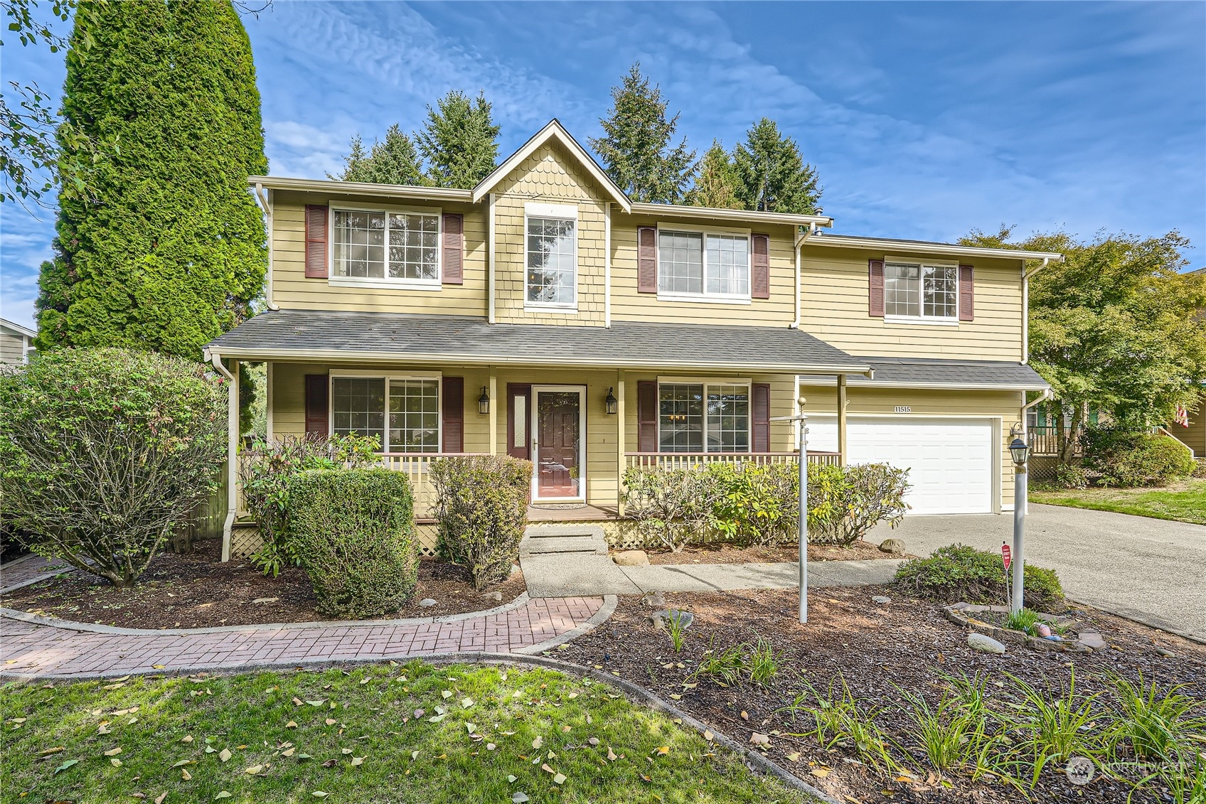 front view of a house with a yard