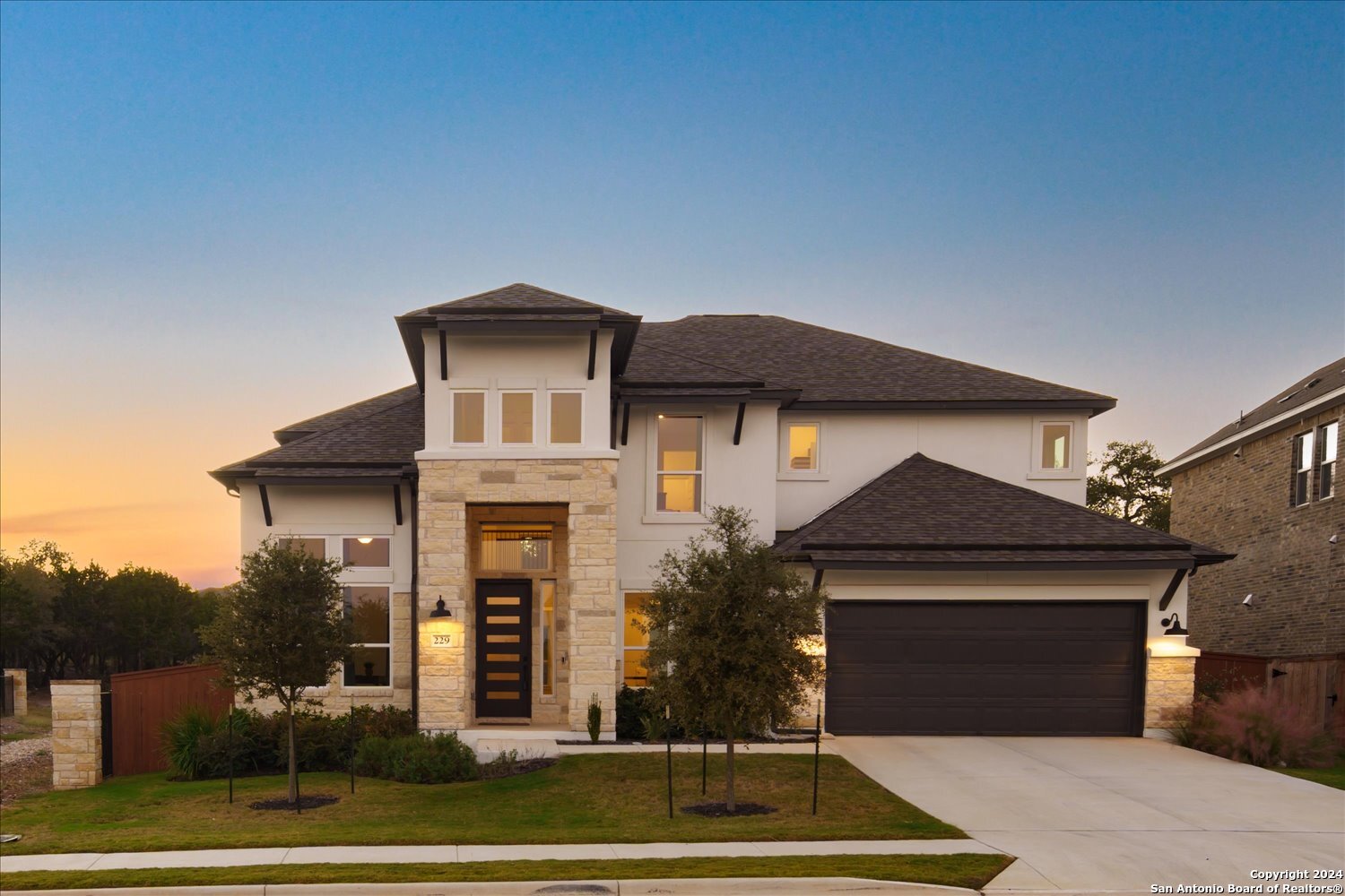 a front view of a house with a yard