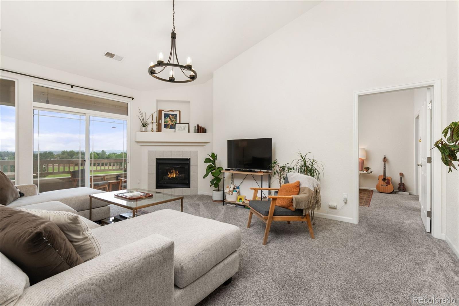 a bedroom with furniture and a flat screen tv